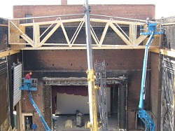 Cranes installing new roof joists